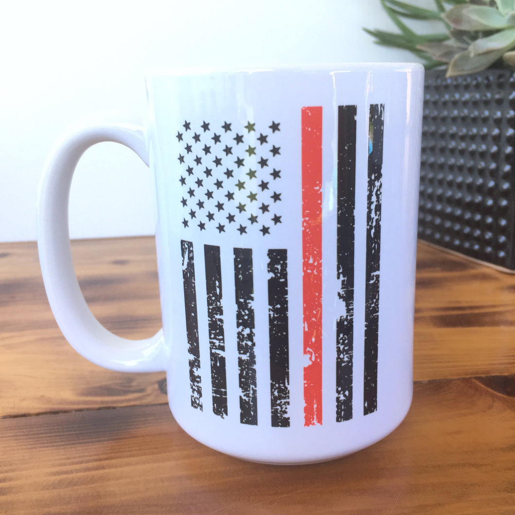 distressed red line flag coffee mug on a wood table with succulent decor 