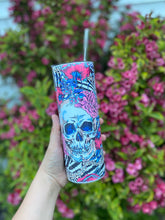 pink floral skull design fully wrapped on a 20 oz skinny tumbler